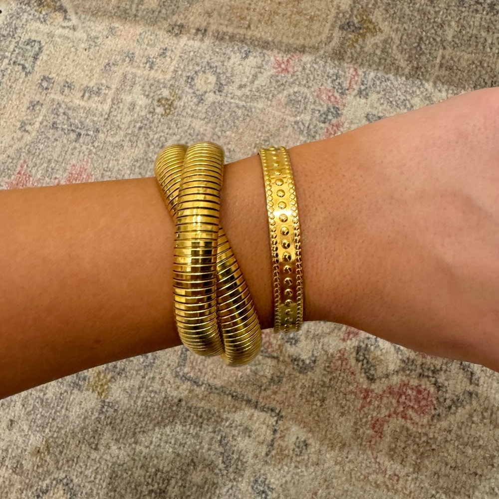 Gold cuff bracelet and gold stretchy bracelet